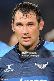 Jaco Pretorius of the Blues is tackled by Ben Lucas and Quade Cooper...  News Photo