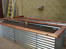 Measure and mark the metal panel for long strips 18 1/2 inches wide. Terrasse En Bois Corrugated Metal Raised Garden Bed
