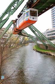 Does anyone know of any instances where roads are placed on top of a suspended train's tracks? The World S Oldest Monorail In Germany Europe Train Sunken City Train