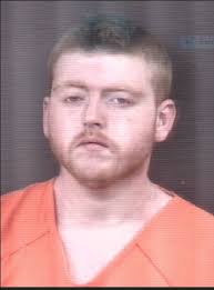 Driver flees, passenger arrested, after truck backs in to squad car