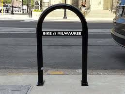 A bicycle parking rack, usually shortened to bike rack and also called a bicycle stand, is a device to which bicycles can be securely attached for parking purposes. Decorative Bike Racks Program