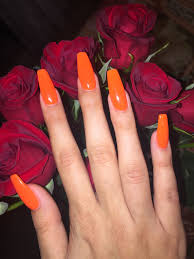 #nailsbyvicky orange dip powder nails with ombré flower accents! My Long Coffin Bright Orange Nails Orange Acrylic Nails Bright Orange Nails Fall Acrylic Nails