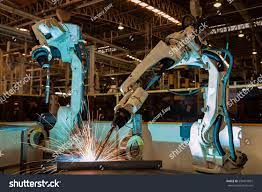 Industrial Robots Are Welding In Car Factory Sponsored Affiliate Robots Industrial Welding Factory Industrial Robots Robot Factory Build A Better World