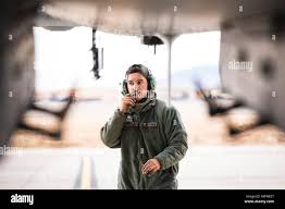 A crew chief communicates with a pilot while launching aircraft from Moron  Air Base, Spain in support of Operation ENDURING FREEDOM. Subject  Operation/Series: ENDURING FREEDOM Base: Moron Air Base State: Sevilla  Country: