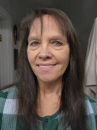 What hairstyle would suit a 59-year-old woman with fine hair that won't  hold a curl?