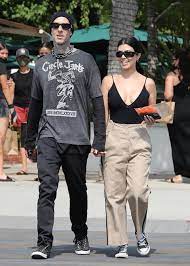 Personality, fashion designer, entrepreneur and model. Kourtney Kardashian Wears Deep Plunge Top With Travis Barker On Malibu Day Date