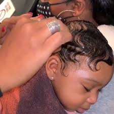 6 month baby getting her hair done for her pictures. Check out the stylist 