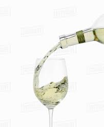 Maybe you would like to learn more about one of these? White Wine Pouring Into A Glass From Bottle Stock Photo Dissolve