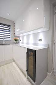 Light grey gloss kitchen with white worktops online dictionary. White Gloss J Pull Contemporary Kitchen With Light Grey Quartz Worktop Modern Kitchen Other By Lords Houzz