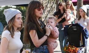 The daughter of actors don johnson and melanie griffith. Dakota Johnson Cuts A Casual Figure As She Dotes On Pal Addison Timlin S Daughter In La Daily Mail Online