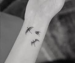 Here we have provided some 18 sample images about emilia clarke tattoo including images, pictures, photos. Close View Of Emilia Clarke S Got Dragons Tattoo Drogon Rhaegal And Viserion Dragon Tattoo Tattoos Small Dragon Tattoos