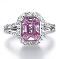 This salmon pink and light orange gem is highly prized for its unique color. Odyssey Octagon Pink Sapphire And Diamond Cluster Dress Ring Pravins