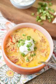 Chicken enchilada soup has everything you love about chicken enchiladas… in one big bowl of soup! Green Onions And A Dollop Of Sour Cream On Creamy Slow Cooker Enchilada Soup Chicken Tortilla Soup Slow Cooker Chicken Tortilla Soup Chicken Tortilla Soup Easy
