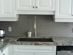 The reflective surface of glass returns light and brightens the kitchen. Glass Tile Backsplash Kitchen Glass Backsplash Glass Tile Backsplash