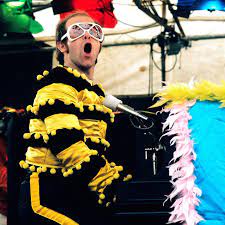 Elton john performs in support of his made in england release at shoreline amphitheatre on sept. See Photos Of Iconic Elton John Performances And Wild Outfits Over The Last 50 Years Elton John Elton John Costume Elton John Songs