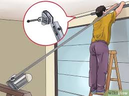 Follow the included instructions to hook up the opener and fasten it to the spring system with a pulley and cable. How To Install A Garage Door Opener With Pictures Wikihow