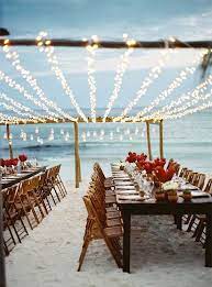 Love Twinkle Lights Especially On The Beach Beach Wedding Decorations Beach Wedding Reception Beach Wedding Inspiration
