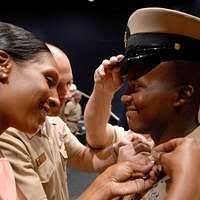 Commander, U.S. 3rd Fleet Command Master Chief Loran Bather introduces  himself to Sailor of the Year (SOY) finalist, Interior Communication  Electrician 1st Class John Zion and his wife.