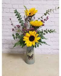 Sympathy flowers with keepsake vase. Heavenly Sunflowers Mccarthy Remick Flowers