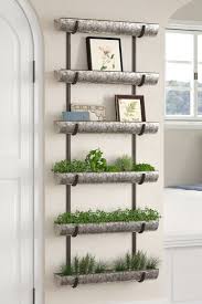 If the outside walls of your apartment have gutters, you can put them to use by planting beautiful flowers by their sides. 21 Vertical Gardens That Ll Give Life To Your Small Space