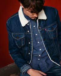 Double Denim And Down Get Cozy This Holiday Season With A Sherpa Lined Trucker Jacket Use It To Top Off Yo Denim Jacket Men Double Denim Fashion Mens Outfits