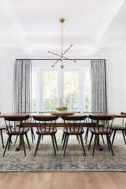 Traditional Modern Dining Table Wood Table And Chairs Vintage Rug Blue Drapes White Walls Brass Dining Room Small Minimalist Dining Room Amber Interiors