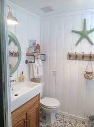 Lovely bathroom beach design ideas with blue cabinets gray cabinets. Beach Cottage Decor Ideas For Your Mobile Home Beach House Bathroom Beach Cottage Decor Beach House Interior