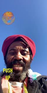 Black Man Walking behind Sun