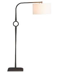 A torchiere is a type of floor lamp which has an upturned shade, casting living room with a modern floor lamp and sectional sofa. Huge Deal On Easton Forged Iron Sectional Floor Lamp Bronze Base With Straight Sided Gallery Shade White