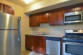 Studio apartment in sherbrooke, quebec, canada, showing double bed, kitchenette, and entrance way with sliding door to closet. Central Park Townhomes 217 Cedar Village Dr York Pa Apartments For Rent Rent Com