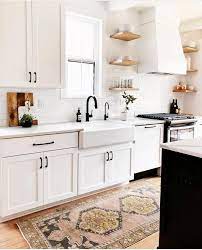 The walls and cabinets painted white not only lighten and brighten a room, but also maintain a visual simplicity and uniformity that makes the small. Adore The Aesthetic Natural Wood Shelves Farmhouse Sink All White Cabinets And Bench Tops Cute D White Kitchen Design Kitchen Cabinet Design Kitchen Layout
