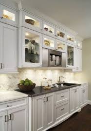 Lit Top Display Cabinets Instead Of Open Shelf Above Storage Cabinets White Contemporary Kitchen Kitchen Design Contemporary Kitchen