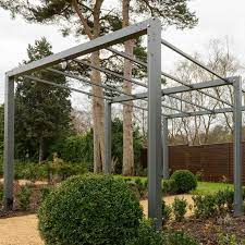 The tulle features net lights clinging to succulents. Contemporary Arch Pergola Harrod Horticultural