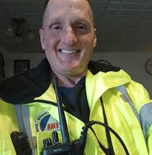 Man picks up trash in downtown area