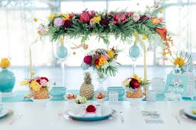 A beach wedding centerpiece with a wood slice, driftwood, candle lanterns and coral blooms plus rope. Tropical Wedding Theme Decorations Novocom Top