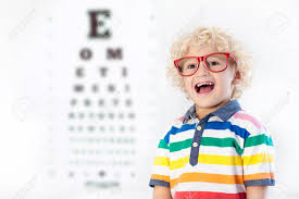 Child At Eye Sight Test Little Kid Selecting Glasses At Optician