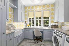 Amazing craft room in laundryroom features teal cabinets opening up to wrapping paper station. Craft Room Ideas Storage Decor Designs Designing Idea