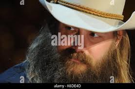 Country music artists Chris Stapleton holds his four CMA Awards at the 2015  CMA Awards in Nashville