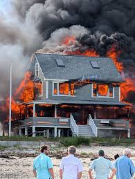 Firefighters battle four‑alarm blaze at Wells Beach home