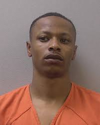 2 charged, 1 wanted in 2022 homicide