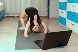 Maybe you would like to learn more about one of these? 4 Years Old Girl Practices Yoga In Front Of A Laptop At Home Stock Photo Picture And Royalty Free Image Image 147882198