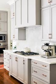 a gray wood paneled kitchen vent hood