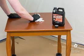 Using the deglosser, apply with a paint brush over the surface of the wood. The Easiest Way To Paint Furniture No Sanding Or Priming Practically Functional