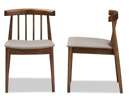 With A Spindle Back And Gray Upholstered Seat This Set Of Dining Chairs Makes A Versatile Addi Dining Chairs Solid Wood Dining Chairs Walnut Wood Dining Chair