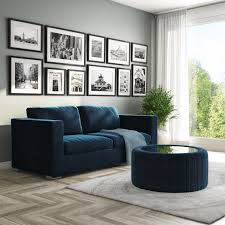 Ottoman coffee tables are cool and pretty easy to work with, especially if you like casual decors because no matter how much you try you could never make a space look completely formal if there's an ottoman coffee table at its center. Navy Blue Velvet Ottoman Storage Pouffe With Glass Top Coffee Table Clio Buyitdirect Ie