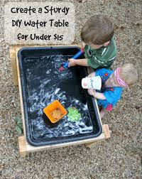 Make A Diy Water Table For Less Than 15 Bare Feet On The Dashboard Water Table Outdoor Kids Diy Toddler