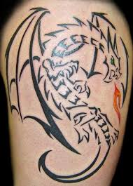 A breathtaking dragon inked on men with two paws. 9 Most Stunning Tribal Dragon Tattoo Designs I Fashion Styles