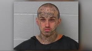 Gang member wanted for shooting at officer caught hiding in gas station