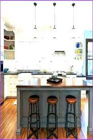 In this kitchen in birmingham, alabama, the design team used four lucite counter stools to let the brass hardware on the base of the island shine through. Venta Island With Stools Underneath En Stock