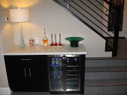 Outdoor kitchen cabinet solutions provide a stylish and functional space when it comes to an outdoor kitchen, an outdoor grill is an absolute essential. Wine Refrigerator And New Staircase Just Finished The Remodel On My Kitchen Trendy Kitchen Backsplash Kitchen Cabinets Painted Grey Outdoor Kitchen Design